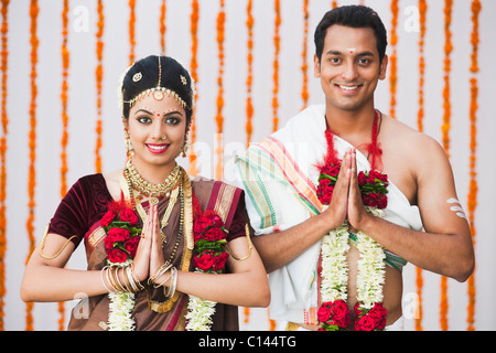 Portrait of a newlywed couple greeting Stock Photo