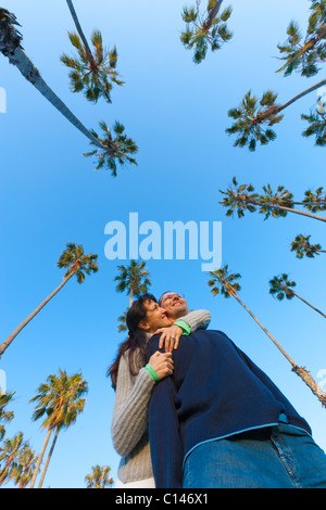 Couple walking along beach path in Chase Palm Park in Santa Barbara, California. Stock Photo