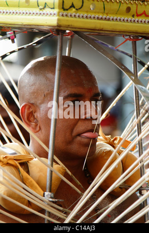 A Hindu devotee carrying a Kavadi during the festival of Thaipusam at Batu Caves, Malaysia Stock Photo