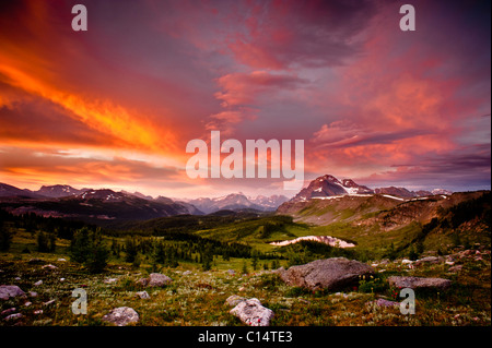 Sunrise from a ridge overlooking a mountain valley.  Banff National Park, Alberta, Canada. Stock Photo