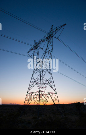 Power transmission towers and lines at sunset Stock Photo