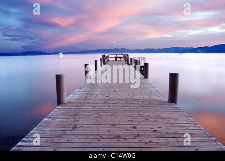 A pier at sunrise on the west shore of Lake Tahoe, California. Stock Photo