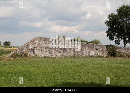 The concrete breezeblock walls of the launch ramp on the V1 launch site in the Le Bois des Huit-Rues near Hazebrouck, France. Stock Photo