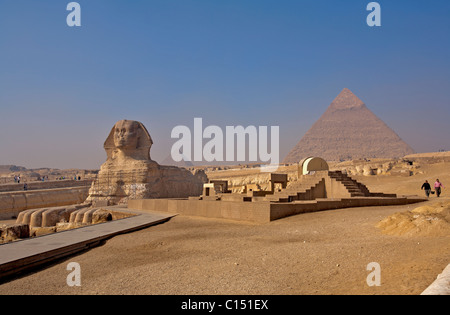 The morning smoke clears to view the Sphinx at the base of the Pyramid of Khafre (Chephren) in Giza, Egypt Stock Photo