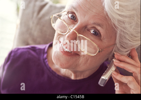 Portrait of senior woman using cell phone Stock Photo