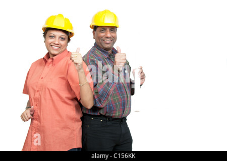 Construction colleagues giving thumbs up after achieving the desired results. Stock Photo