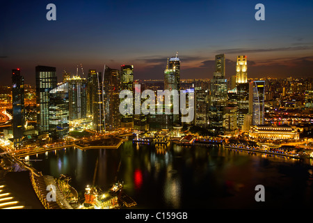 Singapore City Skyline by River at Dusk Aerial View Stock Photo
