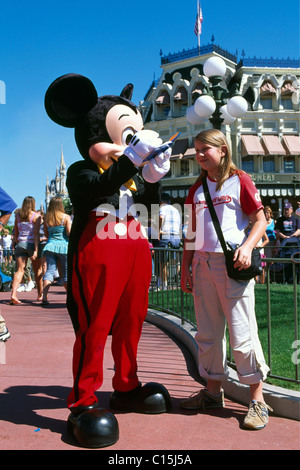 Mickey Mouse giving a girl his autograph, Disneyworld, Disney World, Orlando, Florida, USA Stock Photo