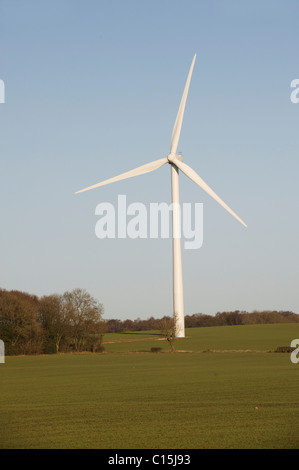 Wind Turbines Generating Renewable Electrical Power on a bright day with blue sky Stock Photo