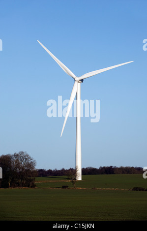 Wind Turbines Generating Renewable Electrical Power on a bright day with blue sky Stock Photo