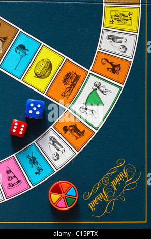 Dice and coloured wedge wedges on Trivial Pursuit board - trivial pursuit game Stock Photo