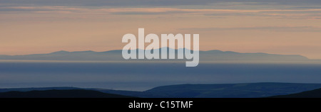 Panoramic view of the Isle of Man at dusk, taken from the summit of Scafell Pike in the English Lake District Stock Photo