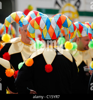 Men wearing jester costumes at the Carnaval (Mardi Gras) celebrations in Sesimbra, Portugal. Stock Photo