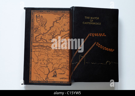 The Mayor of Casterbridge leather bound book resting on box with map of the Wessex region set on white background Stock Photo