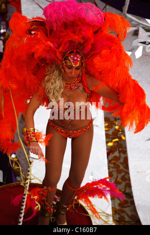 A female Samba dancer wears an ornate costume and headdress at the Carnaval (Mardi Gras) celebrations in Sesimbra, Portugal