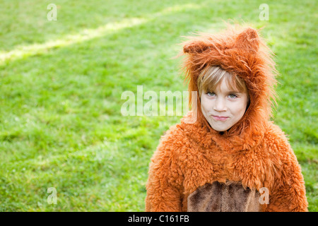 Boy dressed up as bear Stock Photo