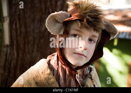 Boy dressed up as bear Stock Photo