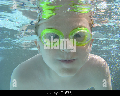 Boy holding breath under water Stock Photo