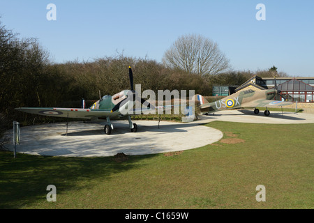The Battle of Britain memorial at Capel le Ferne in Kent. Replicas of a Supermarine Spitfire and a Hawker Hurricane Stock Photo