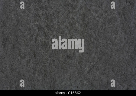 Rough textured background in dark gray stone Stock Photo