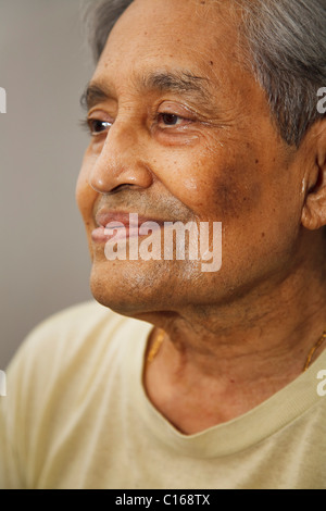 Closeup portrait of an elderly Indian man smiling Stock Photo