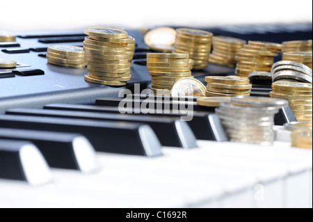 Piano and money, earning money with music Stock Photo