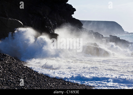 Heavy Atlantic seas with large waves crashing onto rocks at Ajuy on the Canary Island of Fuerteventura Stock Photo
