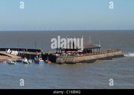 The harbour arm at Broadstairs in Kent with the Thanet array wind farm behind on the horizon Stock Photo