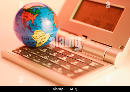Globe and digital clock Stock Photo