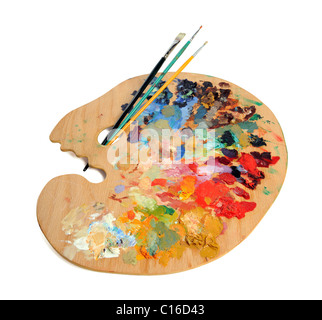Artist palette with paintbrushes over white background Stock Photo