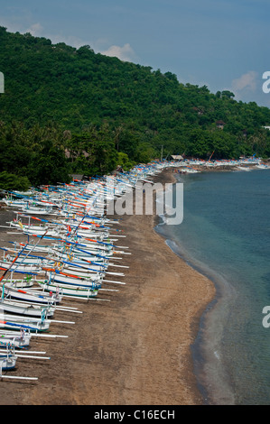 Jemeluk Bay in the Amed area of Bali, Indonesia, is full of traditional fishing boats, called Jukung waiting to go out for work. Stock Photo