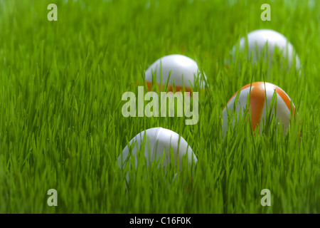 Four Easter eggs on green grass Stock Photo
