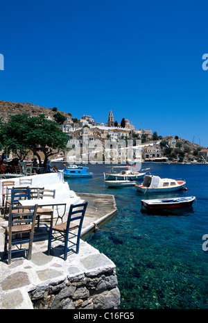 Tavern at the port of Symi Island near Rhodes, Dodecanese, Greece, Europe Stock Photo