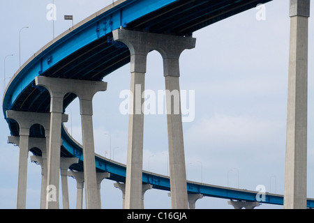 Mission-arched shaped concrete towers of the curved Coronado Bridge in San Diego in California Stock Photo