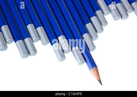 A sharpened pencil among a row of blunt end pencils Stock Photo