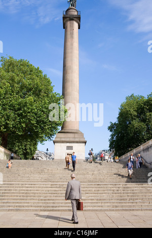 A man in a suit with a briefcase walks from The Mall towards Pall Mall. Stock Photo