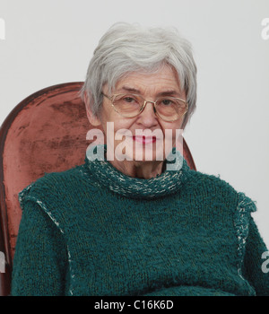 Portrait of an old woman against a gray background Stock Photo