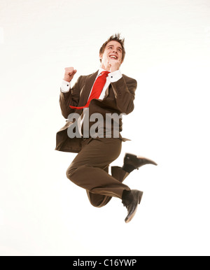 Young businessman, jumping in the air Stock Photo