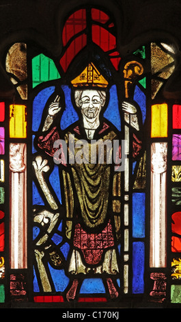 A medieval stained glass window depicting Saint Cuthbert, St Cuthbert's Church, Edenhall near Penrith, Cumbria. Stock Photo