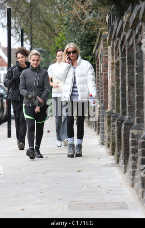 Denise Van Outen goes for a power walk with her trainer Nicki Waterman wearing a 'Red Nose Climb' jacket to promote her seven Stock Photo