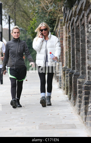 Denise Van Outen goes for a power walk with her trainer Nicki Waterman wearing a 'Red Nose Climb' jacket to promote her seven Stock Photo