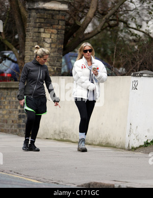 Denise Van Outen goes for a power walk with her trainer, Nicki Waterman. Denise is wearing a 'Red Nose Climb' jacket to promote Stock Photo
