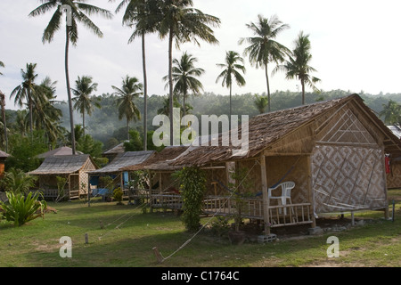 Bamboo huts of a private run bungalows on Loh Dalum beach in Phi Phi Island, Krabi, south of Thailand. Stock Photo