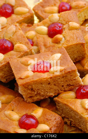 Honey cake with almonds and Maraschino cherries Stock Photo