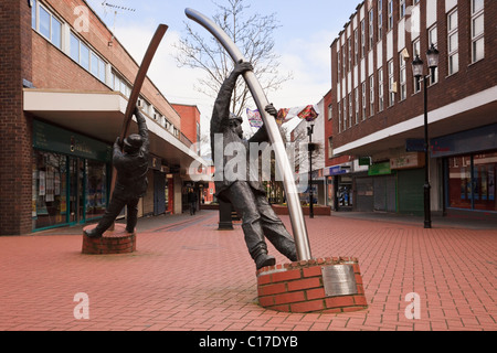 The Arc (Y Bwa) metal figures sculpture by David Annand in town centre. Lord Street, Wrexham, North Wales, UK, Britain Stock Photo