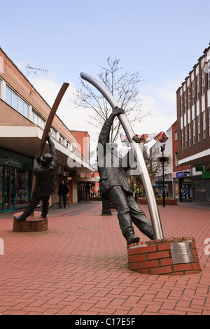 The Arc (Y Bwa) metal figures sculpture by David Annand in town centre. Lord Street, Wrexham, North Wales, UK, Britain Stock Photo