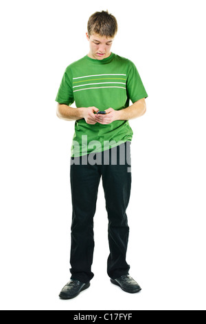 Young man texting on cellphone standing full body isolated on white background Stock Photo