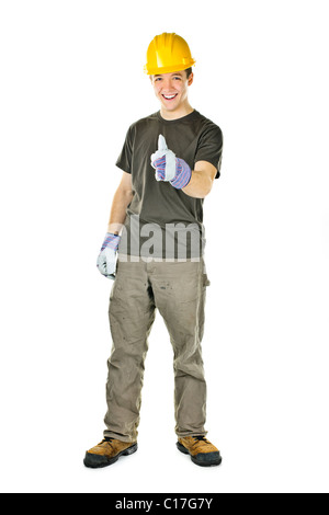 Smiling construction worker showing thumbs up isolated on white background Stock Photo