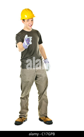 Young construction worker with hard hat pointing isolated on white background Stock Photo