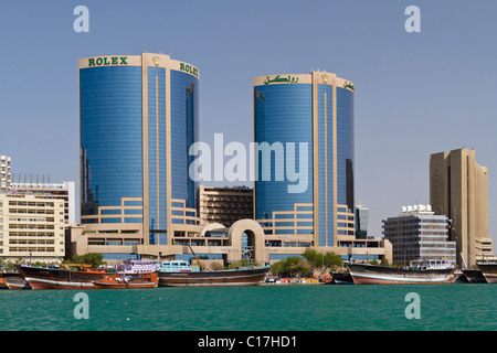 The Dubai Creek skyline with wooden Dow boats in Dubai, UAE. Stock Photo
